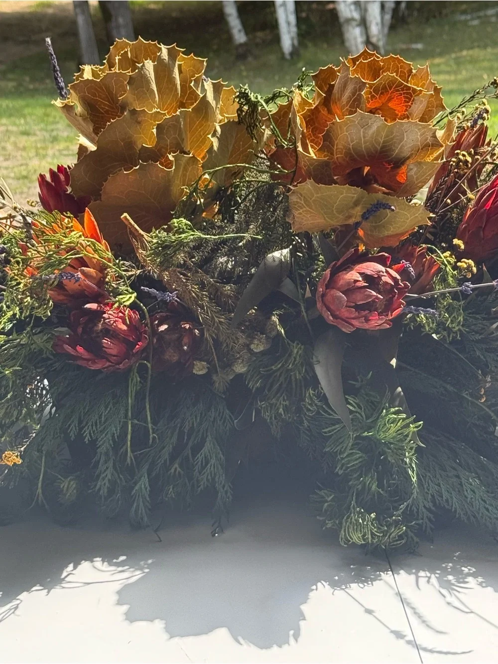 Autumn table center piece or decoration floral leaves full in planter box
